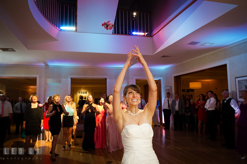 Bride tossed the wedding bouquet to female guests. Aspen Wye River Conference Centers wedding at Queenstown Maryland, by wedding photographers of Leo Dj Photography. http://leodjphoto.com