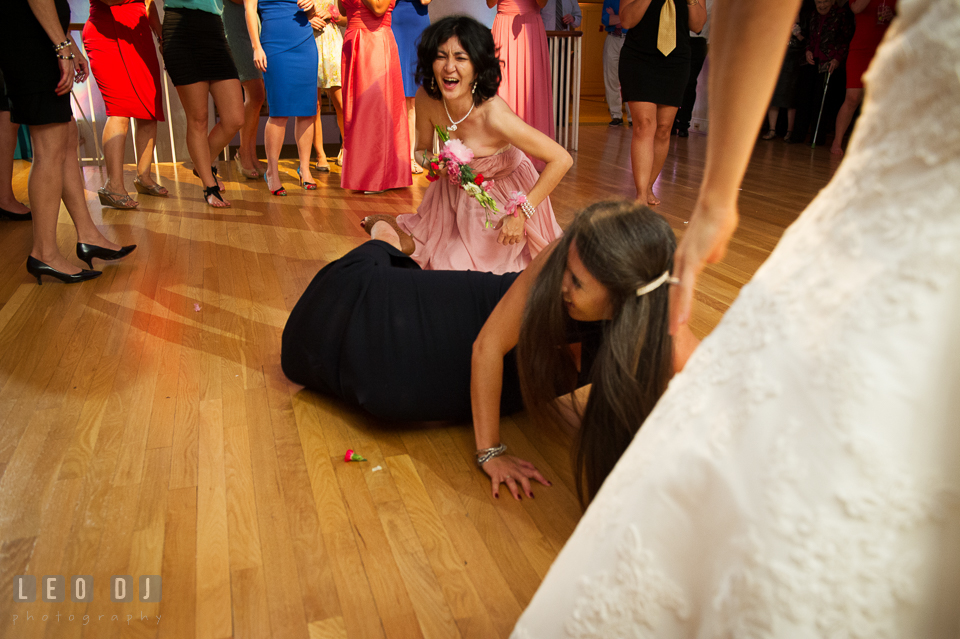 One girl got the wedding bouquet got up from floor. Aspen Wye River Conference Centers wedding at Queenstown Maryland, by wedding photographers of Leo Dj Photography. http://leodjphoto.com