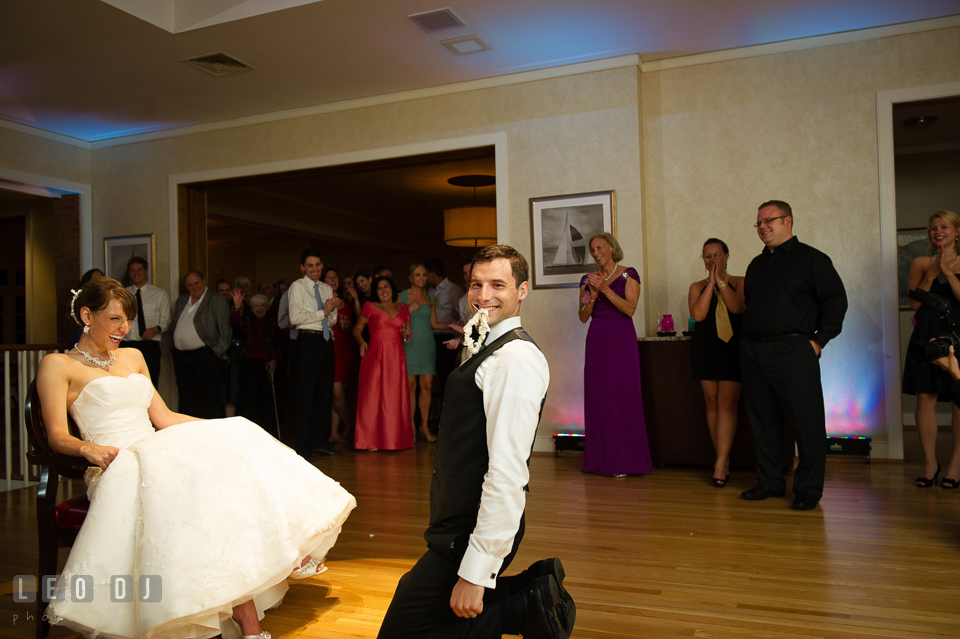 Groom removed garter belt from Bride. Aspen Wye River Conference Centers wedding at Queenstown Maryland, by wedding photographers of Leo Dj Photography. http://leodjphoto.com