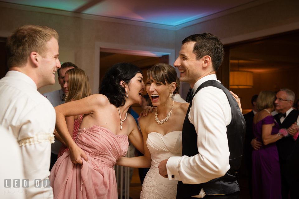 Bride and Groom laughing and dancing with their friends. Aspen Wye River Conference Centers wedding at Queenstown Maryland, by wedding photographers of Leo Dj Photography. http://leodjphoto.com