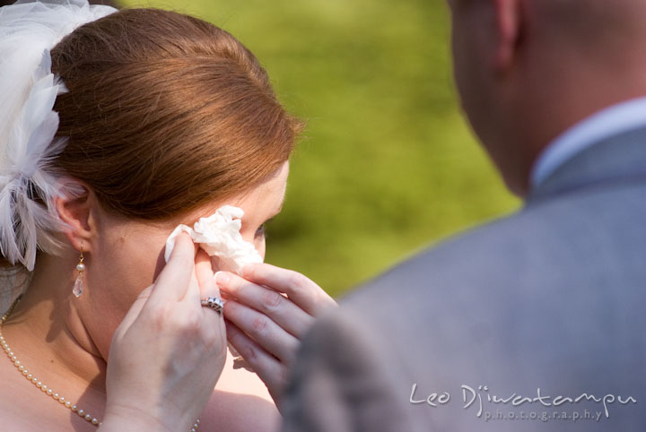 Bride wipes of tears as she recited her vows. Mariott Aspen Wye River Conference Center Wedding photos at Queenstown Eastern Shore Maryland, by photographers of Leo Dj Photography.