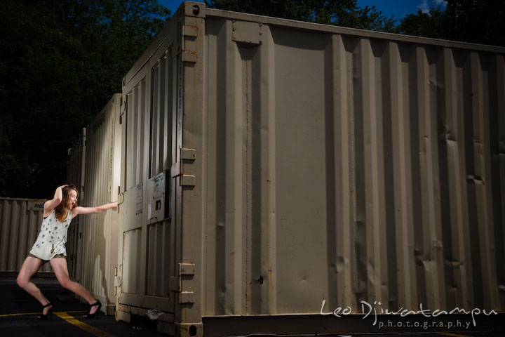 Girl model screaming by trailer storage containers. Lighting Essentials Workshops - Baltimore with Don Giannatti