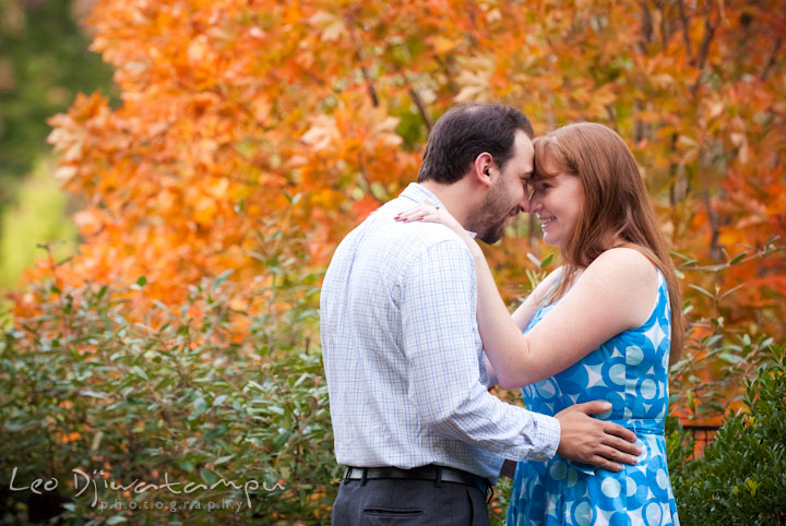 An engaged couple cuddling. Washington DC National Zoo pre-wedding engagement session by Leo Dj Photography