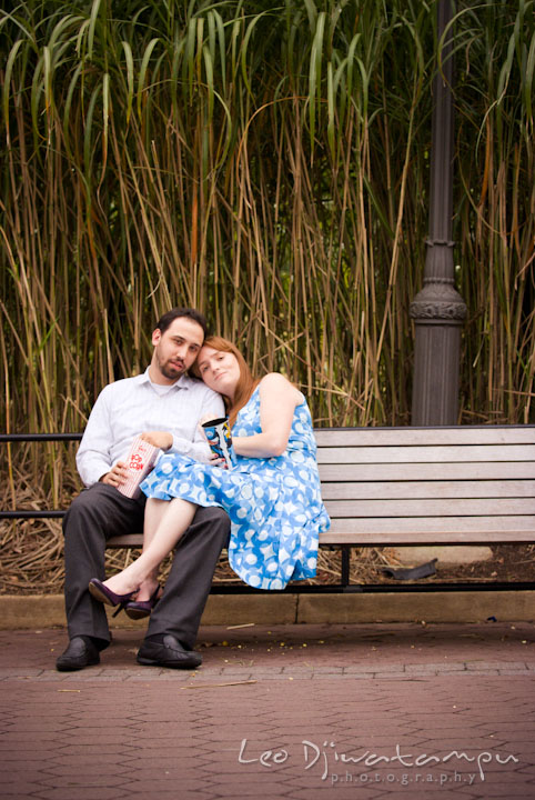 Engaged guy and girl sitting on a bench. Washington DC National Zoo pre-wedding engagement session by Leo Dj Photography