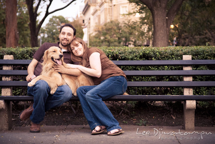 Engaged couple and their golden retriever posing on a bench. Dupont Circle Washington DC pre-wedding engagement session by Leo Dj Photography