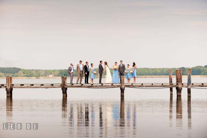 Bride and Groom with the wedding party at the dock. Harbourtowne Golf Resort wedding photos at St. Michaels, Eastern Shore, Maryland by photographers of Leo Dj Photography.