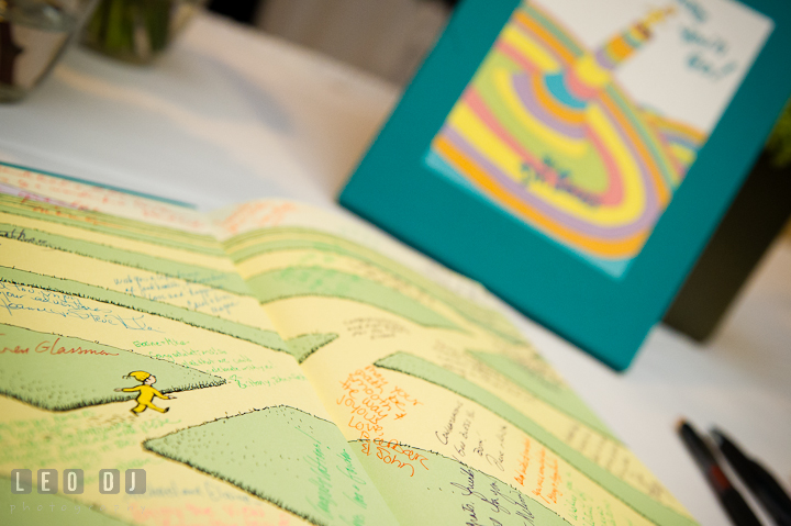 Guest signature book using Dr. Seuss book Oh, the Places You'll Go! Harbourtowne Golf Resort wedding photos at St. Michaels, Eastern Shore, Maryland by photographers of Leo Dj Photography.