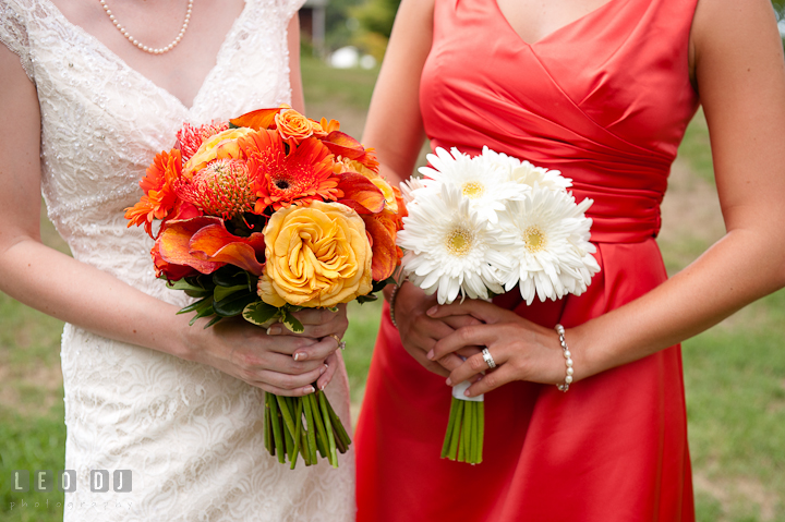 Bride and Matron of honor holding their beautiful floral bouquets. Historic London Town and Gardens wedding photos at Edgewater Annapolis, Maryland by photographers of Leo Dj Photography. http://leodjphoto.com