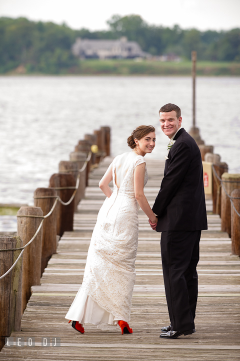 Bride and Groom holding hands at the pier. Historic London Town and Gardens wedding photos at Edgewater Annapolis, Maryland by photographers of Leo Dj Photography. http://leodjphoto.com