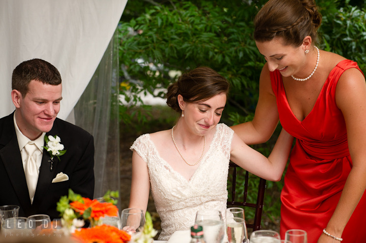 Bride emotional after listening to Matron of Honor's speech. Historic London Town and Gardens wedding photos at Edgewater Annapolis, Maryland by photographers of Leo Dj Photography. http://leodjphoto.com