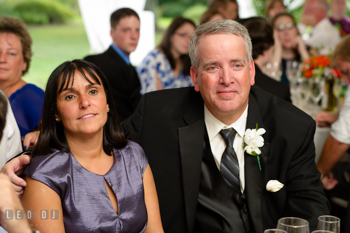 Father of the Bride smiling listening to Best Man's speech. Historic London Town and Gardens wedding photos at Edgewater Annapolis, Maryland by photographers of Leo Dj Photography. http://leodjphoto.com