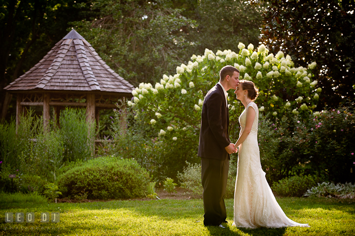 Bride and Groom kissed by the gazebo. Historic London Town and Gardens wedding photos at Edgewater Annapolis, Maryland by photographers of Leo Dj Photography. http://leodjphoto.com