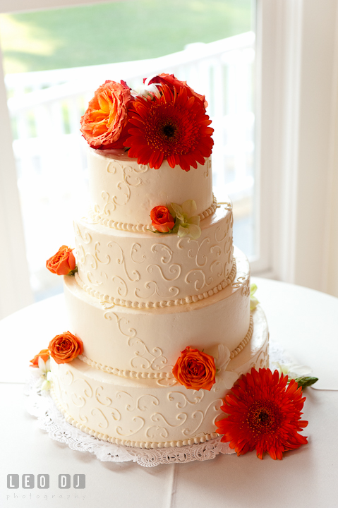 Beautiful cake from Fiona's Cakes decorated with orange flowers. Historic London Town and Gardens wedding photos at Edgewater Annapolis, Maryland by photographers of Leo Dj Photography. http://leodjphoto.com