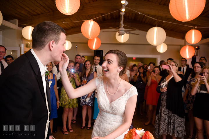 Bride feeding cake to Groom during cake cutting. Historic London Town and Gardens wedding photos at Edgewater Annapolis, Maryland by photographers of Leo Dj Photography. http://leodjphoto.com