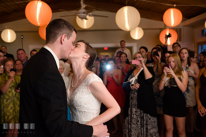 Bride and Groom kissing after the cake cutting. Historic London Town and Gardens wedding photos at Edgewater Annapolis, Maryland by photographers of Leo Dj Photography. http://leodjphoto.com