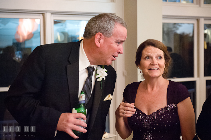 Mother and Father of Groom talking. Historic London Town and Gardens wedding photos at Edgewater Annapolis, Maryland by photographers of Leo Dj Photography. http://leodjphoto.com