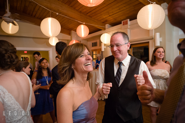 Bride's Mother and Father dancing and laughing. Historic London Town and Gardens wedding photos at Edgewater Annapolis, Maryland by photographers of Leo Dj Photography. http://leodjphoto.com