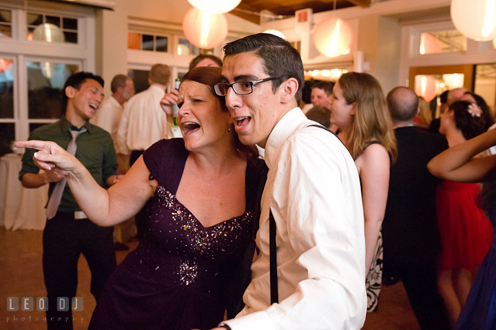 Groom's Mother singing together with another guest. Historic London Town and Gardens wedding photos at Edgewater Annapolis, Maryland by photographers of Leo Dj Photography. http://leodjphoto.com