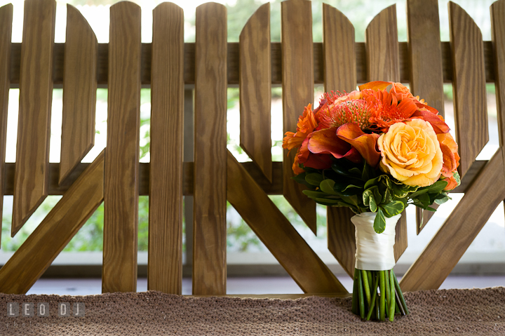 Beautiful orange themed flower bouquet for the Bride. Saint John the Evangelist church wedding ceremony photos at Severna Park, Maryland by photographers of Leo Dj Photography. http://leodjphoto.com