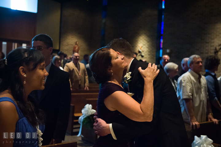 Groom hugging his Mother. Saint John the Evangelist church wedding ceremony photos at Severna Park, Maryland by photographers of Leo Dj Photography. http://leodjphoto.com