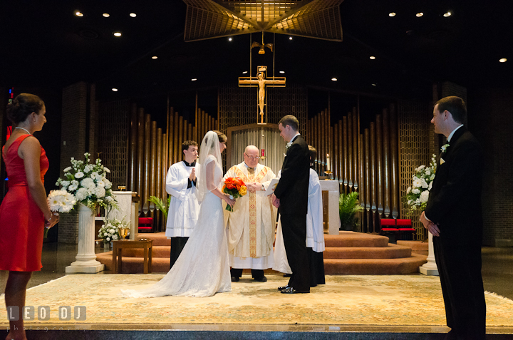 Bride, Groom, Matron of Honor and Best Man in the sanctuary. Saint John the Evangelist church wedding ceremony photos at Severna Park, Maryland by photographers of Leo Dj Photography. http://leodjphoto.com