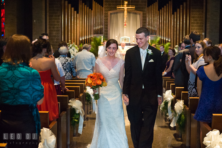 Bride and Groom walking out during the recessional. Saint John the Evangelist church wedding ceremony photos at Severna Park, Maryland by photographers of Leo Dj Photography. http://leodjphoto.com