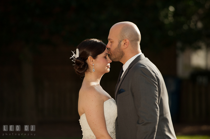 Groom kissed Bride on her forehead during first look. The Tidewater Inn wedding, Easton, Eastern Shore, Maryland, by wedding photographers of Leo Dj Photography. http://leodjphoto.com