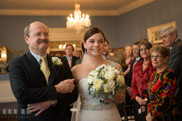 Bride sheds tear as walking down the aisle escorted by Father during processional. The Tidewater Inn wedding, Easton, Eastern Shore, Maryland, by wedding photographers of Leo Dj Photography. http://leodjphoto.com