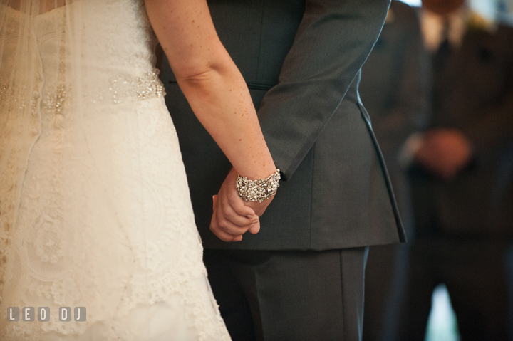 Bride and Groom holding hands during ceremony. The Tidewater Inn wedding, Easton, Eastern Shore, Maryland, by wedding photographers of Leo Dj Photography. http://leodjphoto.com