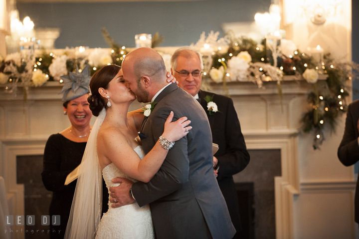 Bride and Groom kissed after pronounced as Husband and Wife by officiants. The Tidewater Inn wedding, Easton, Eastern Shore, Maryland, by wedding photographers of Leo Dj Photography. http://leodjphoto.com