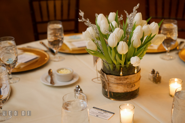 Floral table centerpiece with white tulips by florist Monteray Farms. The Tidewater Inn wedding, Easton, Eastern Shore, Maryland, by wedding photographers of Leo Dj Photography. http://leodjphoto.com