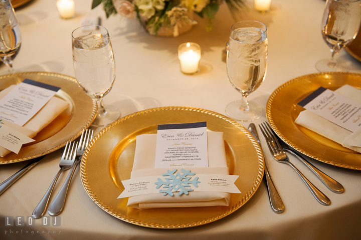 Table setting with golden plates, menu, with winter themed decoration. The Tidewater Inn wedding, Easton, Eastern Shore, Maryland, by wedding photographers of Leo Dj Photography. http://leodjphoto.com