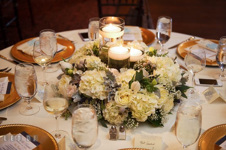 Candle table centerpiece with white roses and hydrangeas by florist Monteray Farms. The Tidewater Inn wedding, Easton, Eastern Shore, Maryland, by wedding photographers of Leo Dj Photography. http://leodjphoto.com