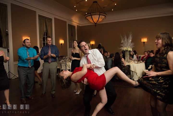 A couple doing the dip accidentally almost opened another guest's skirt. The Tidewater Inn wedding, Easton, Eastern Shore, Maryland, by wedding photographers of Leo Dj Photography. http://leodjphoto.com