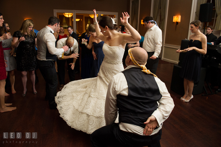 Bride twirling her dress while dancing with Groomsman. The Tidewater Inn wedding, Easton, Eastern Shore, Maryland, by wedding photographers of Leo Dj Photography. http://leodjphoto.com