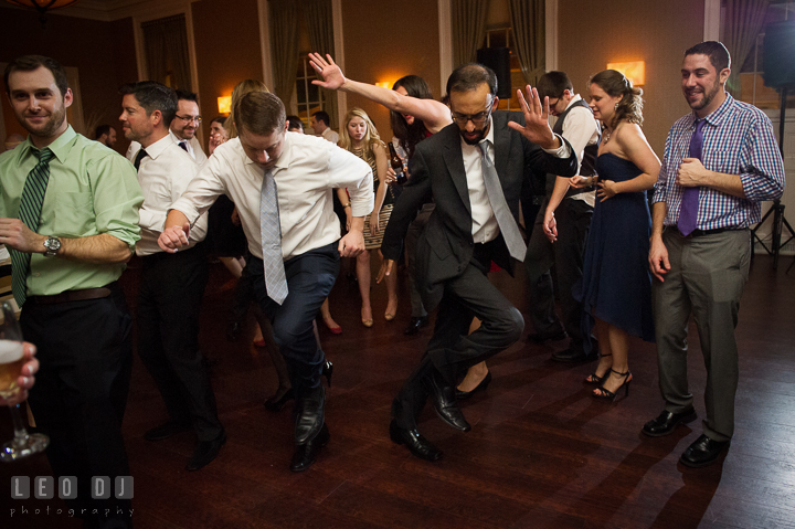 Two guests showing their cool moves dancing to music by DJ from Absolute Entertainment. The Tidewater Inn wedding, Easton, Eastern Shore, Maryland, by wedding photographers of Leo Dj Photography. http://leodjphoto.com