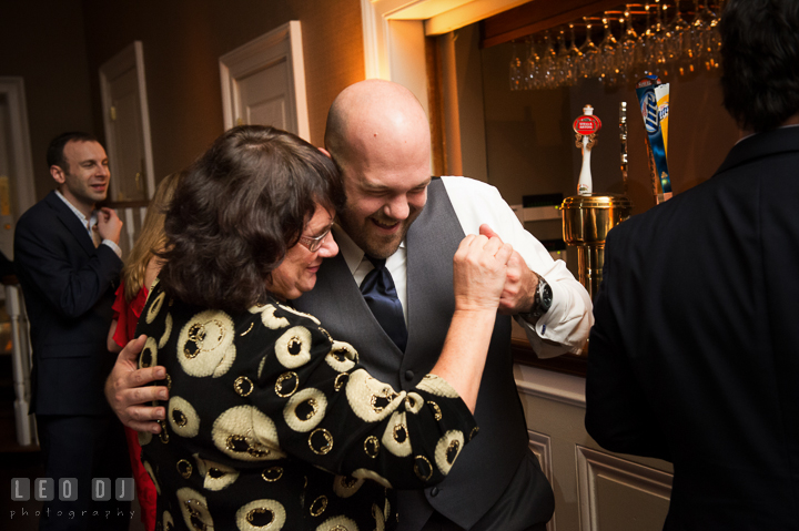 Impromptu dance of Groom with his Mother in front of the bar. The Tidewater Inn wedding, Easton, Eastern Shore, Maryland, by wedding photographers of Leo Dj Photography. http://leodjphoto.com