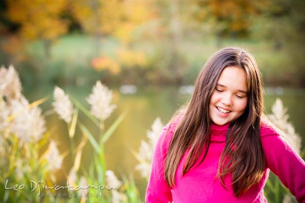 cute girl kid in pink shirt smiling, looking down. Commercial comp card photograper Kent Island Annapolis MD Washington DC