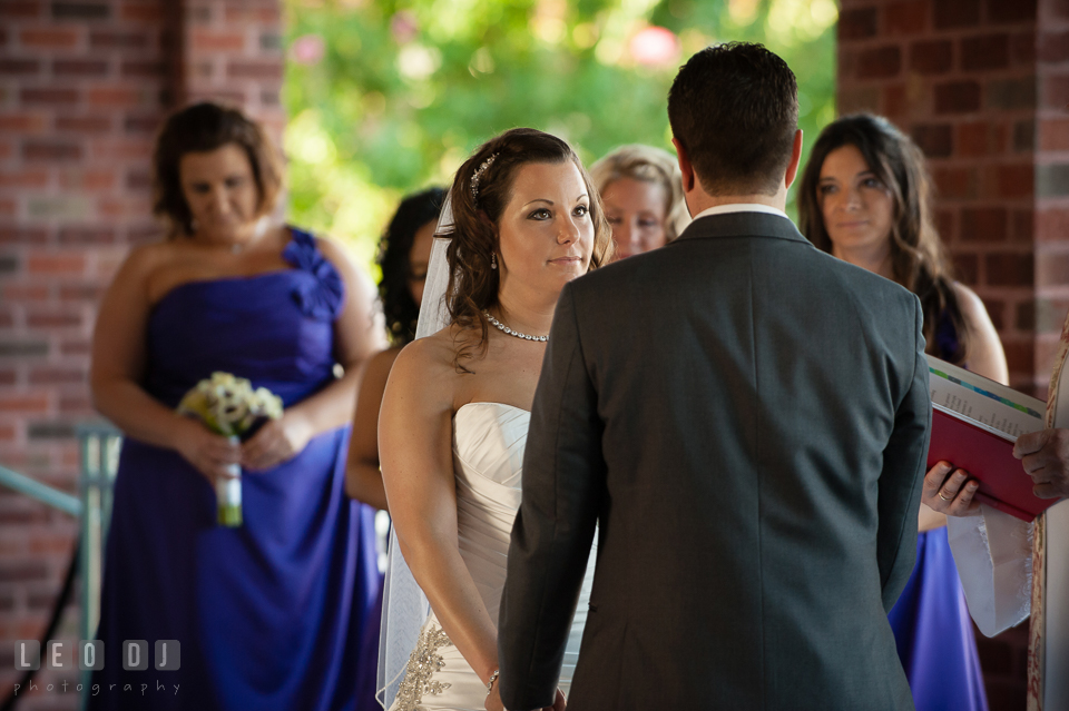 Bride looking at Groom during wedding ceremony. Harbour View Events Woodbridge Virginia wedding ceremony and reception photo, by wedding photographers of Leo Dj Photography. http://leodjphoto.com