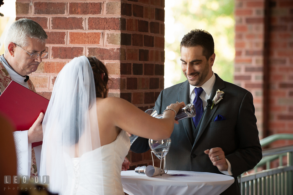 Bride and Groom pouring sands during the Unity Sand Ceremony. Harbour View Events Woodbridge Virginia wedding ceremony and reception photo, by wedding photographers of Leo Dj Photography. http://leodjphoto.com