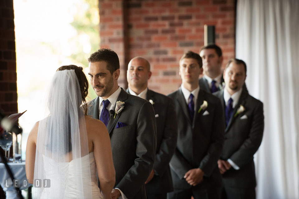 Groom looking at the Bride during wedding ceremony. Harbour View Events Woodbridge Virginia wedding ceremony and reception photo, by wedding photographers of Leo Dj Photography. http://leodjphoto.com