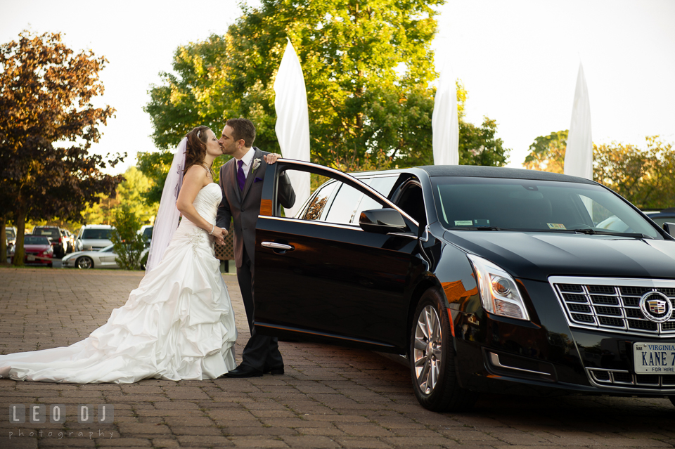 Bride and Groom kissing in front of Limo. Harbour View Events Woodbridge Virginia wedding ceremony and reception photo, by wedding photographers of Leo Dj Photography. http://leodjphoto.com