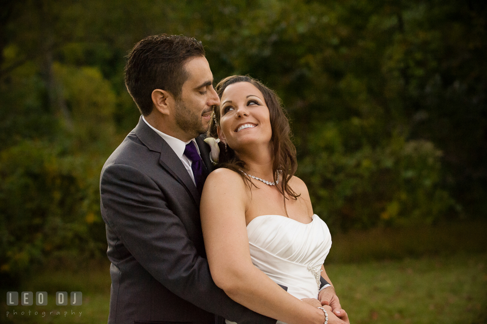 The Bride and Groom hugging. Harbour View Events Woodbridge Virginia wedding ceremony and reception photo, by wedding photographers of Leo Dj Photography. http://leodjphoto.com