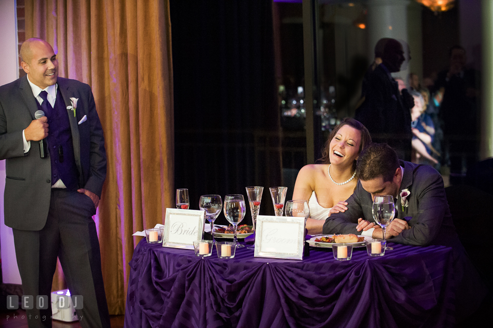 Bride and Groom laughing to toast speeches from Best Man. Harbour View Events Woodbridge Virginia wedding ceremony and reception photo, by wedding photographers of Leo Dj Photography. http://leodjphoto.com