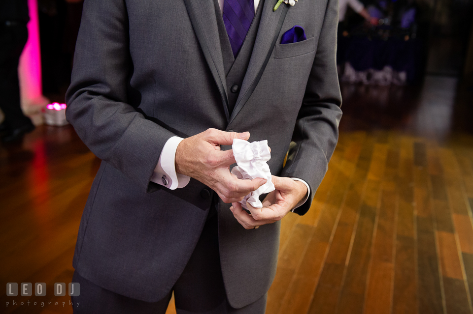 Groom found the garter. Harbour View Events Woodbridge Virginia wedding ceremony and reception photo, by wedding photographers of Leo Dj Photography. http://leodjphoto.com