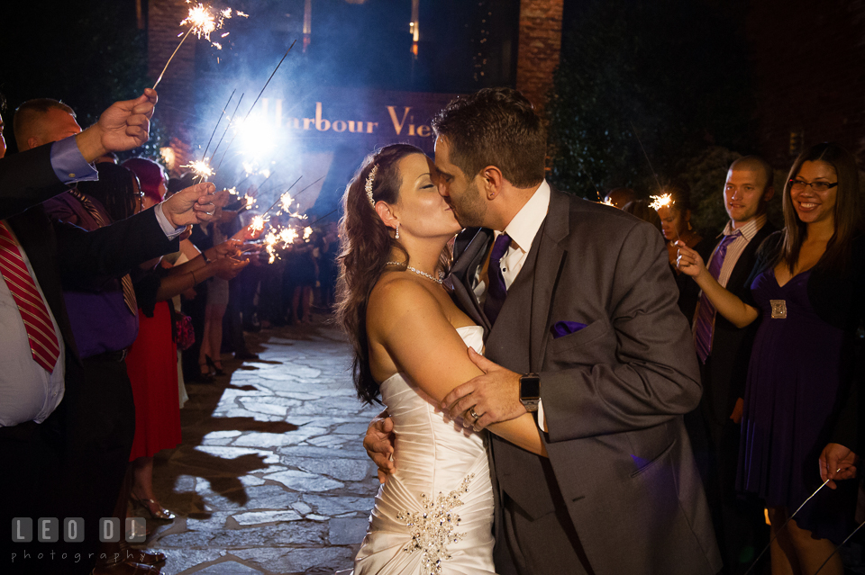 Bride and Groom kissing during grand exit with sparklers. Harbour View Events Woodbridge Virginia wedding ceremony and reception photo, by wedding photographers of Leo Dj Photography. http://leodjphoto.com