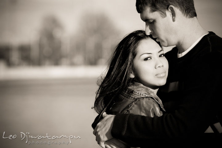 A guy kissed his fiancée on her forehead. City or urban setting pre-wedding or engagement photo session at Annapolis, by Annapolis wedding photographer, Leo Dj Photography.