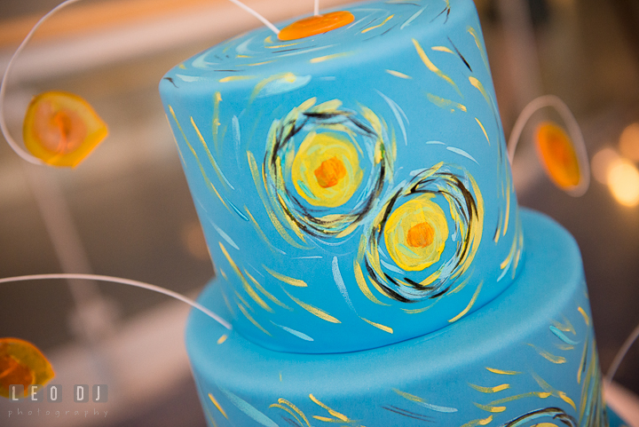 Detail shot of the painting on the wedding cake by Sherry's Cakes and Bakes with decoration taken from the Starry Night painting from Vincent van Gogh. Baltimore Maryland Science Center wedding reception and ceremony photo, by wedding photographers of Leo Dj Photography. http://leodjphoto.com