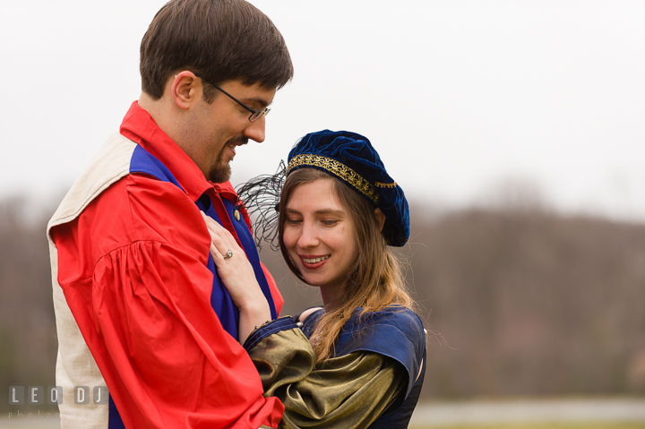 Engaged girl cuddling with her fiancé. Renaissance Costume Cosplay fun theme pre-wedding engagement photo session at Maryland, by wedding photographers of Leo Dj Photography. http://leodjphoto.com