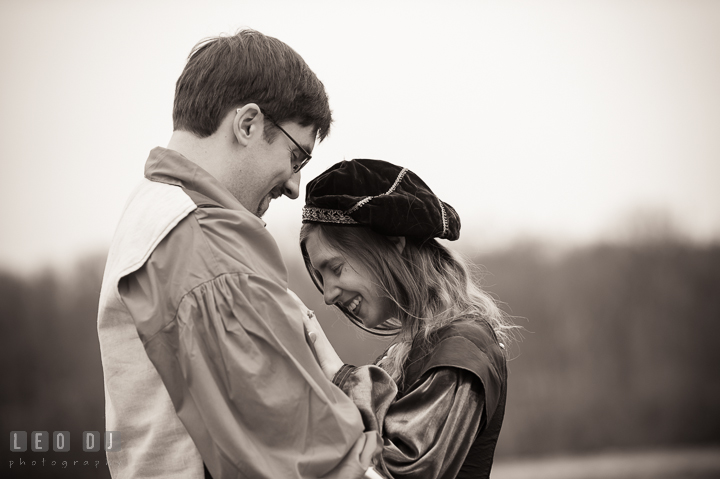 Engaged girl and her fiancé laughing together. Renaissance Costume Cosplay fun theme pre-wedding engagement photo session at Maryland, by wedding photographers of Leo Dj Photography. http://leodjphoto.com